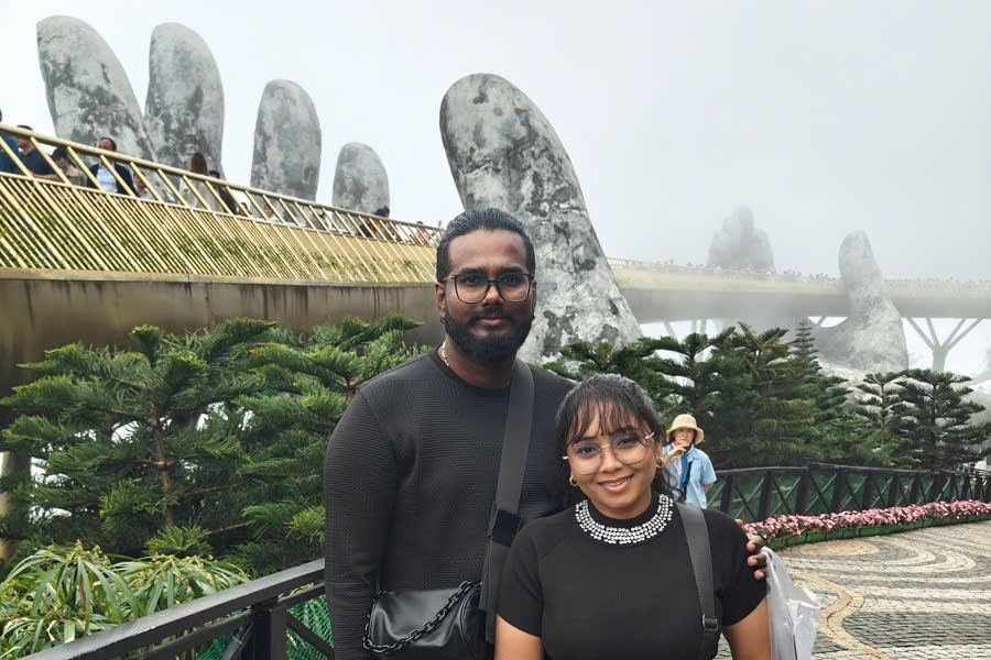 Guests taking photos at the Golden Bridge in Ba Na Hills