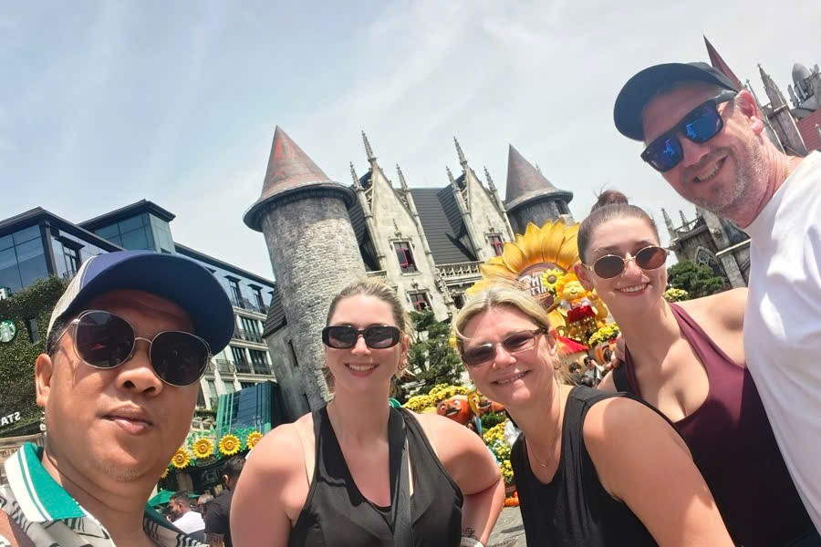 Viet Nguyen takes a selfie with guests at French Village in Ba Na Hills