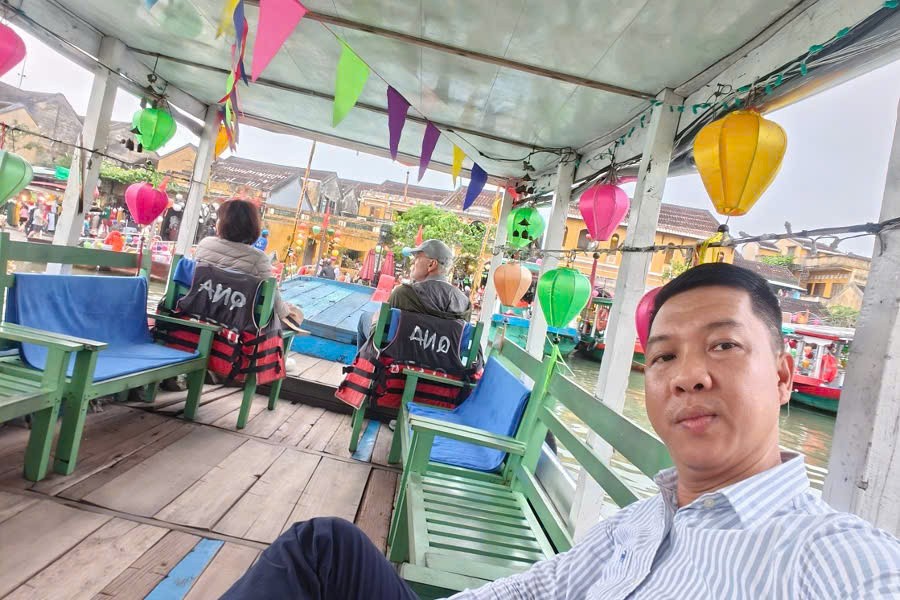 Guests enjoying a river cruise on the Thu Bon River in Hoi An
